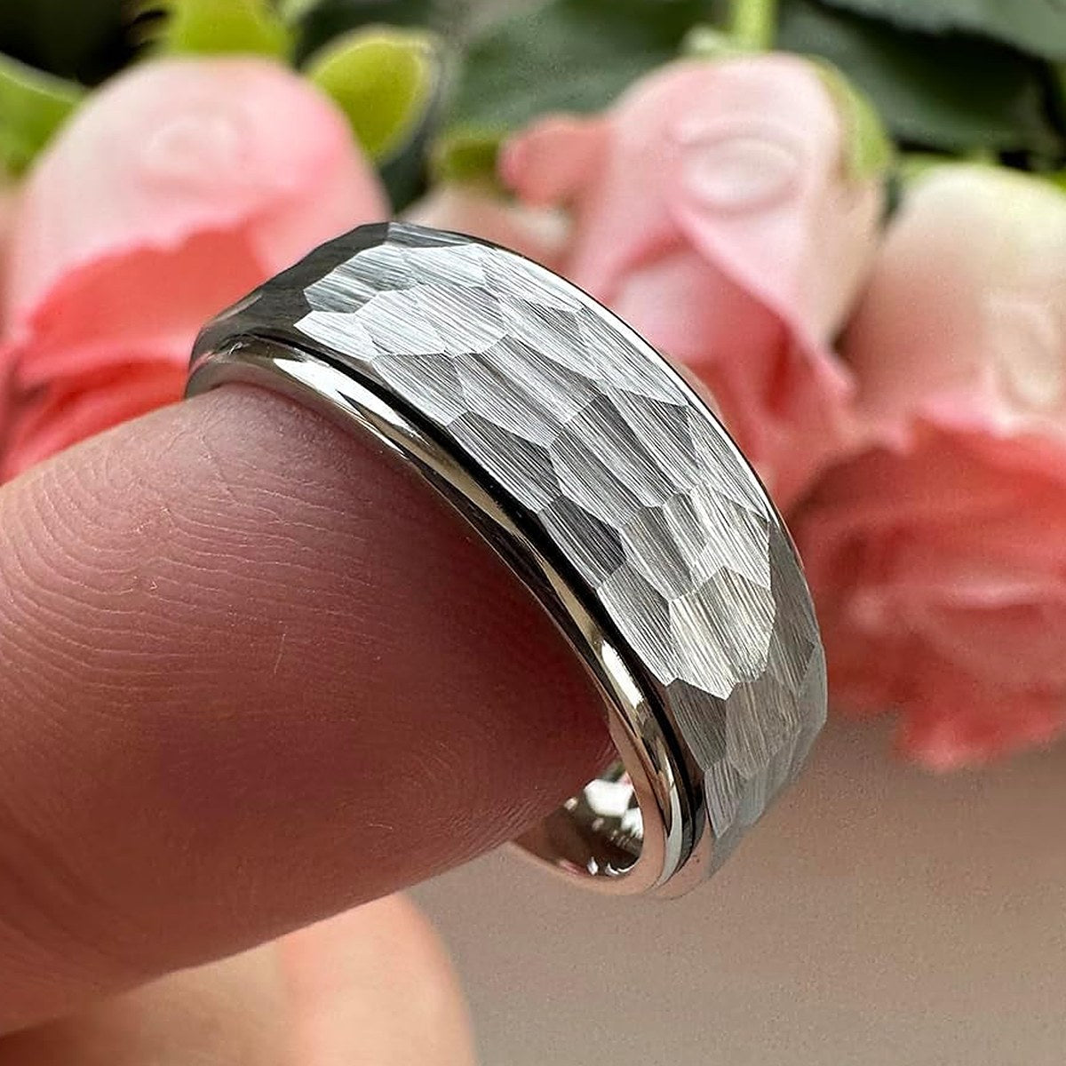 Ridge Ring on a fingertip showing the spinning outer band
