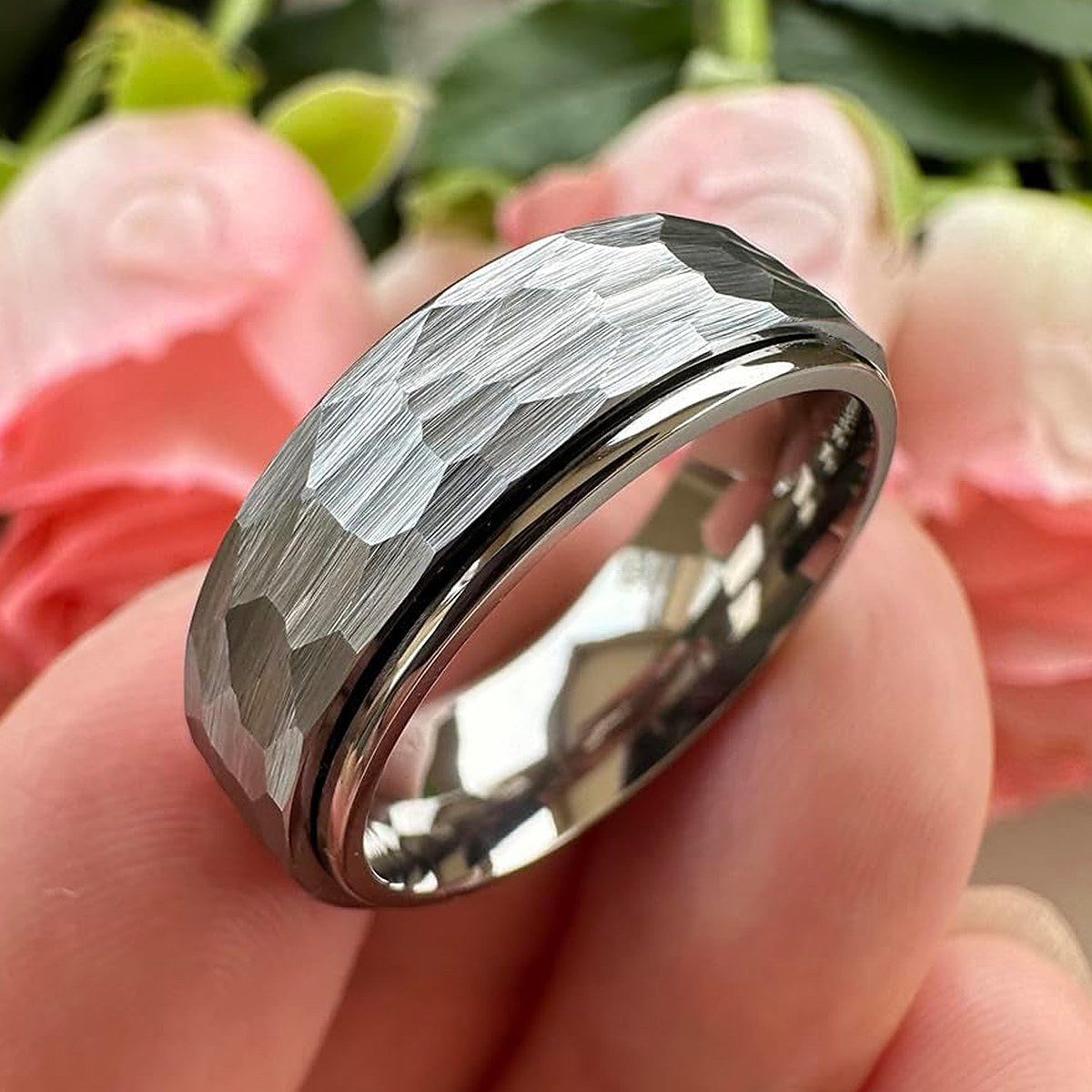 Ridge Ring held between fingers for scale
